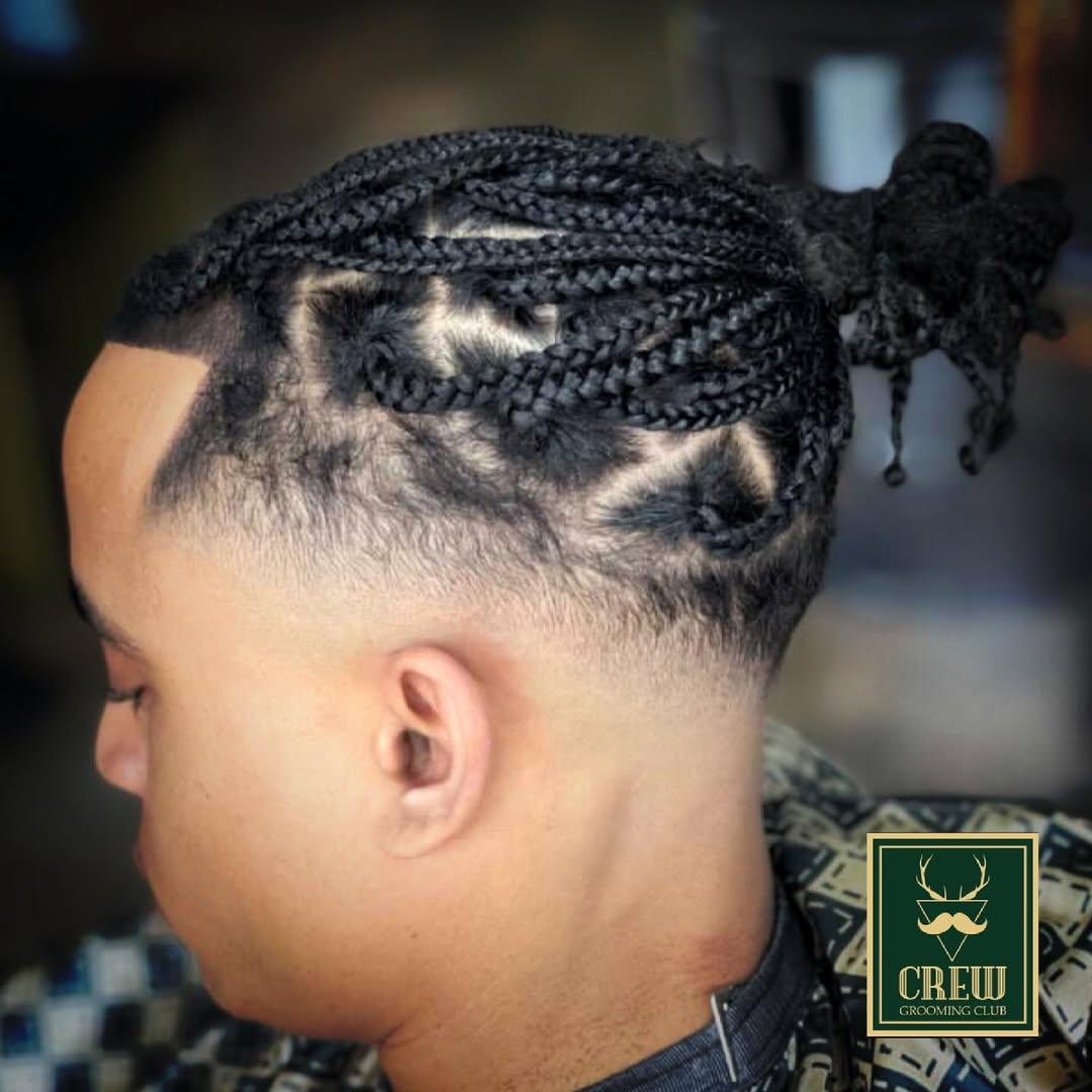 Cornrow braids with a sharp hairline shape-up by a Crew Barbers stylist in Brentford